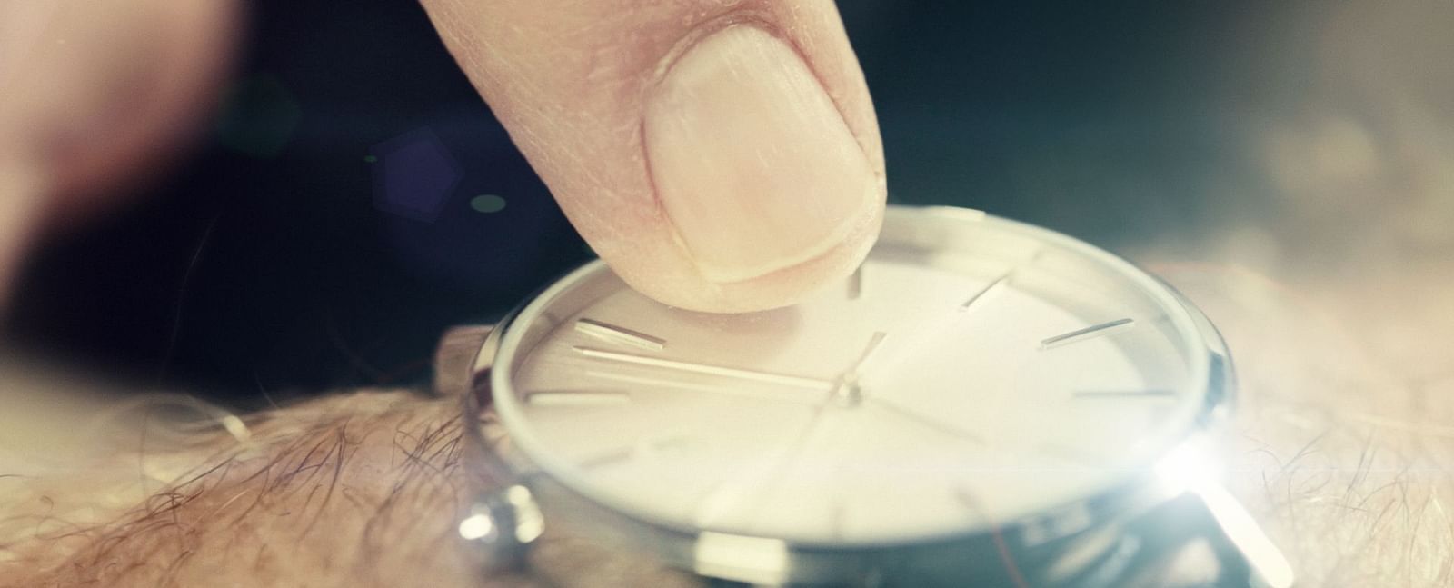 A hand pointing time on a watch - Brewery Gulch Inn & Spa