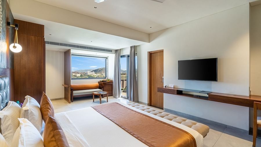 view of king size bed and TV of Suite at Stone Wood Hotel, Kumbhalgarh