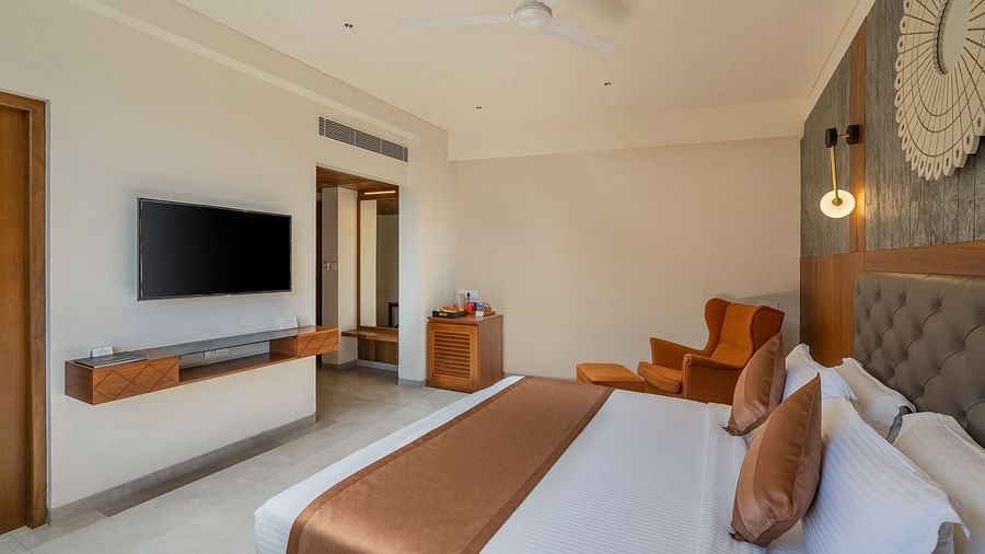 view of king size bed and TV of Superior Room at Stone Wood Hotel, Kumbhalgarh