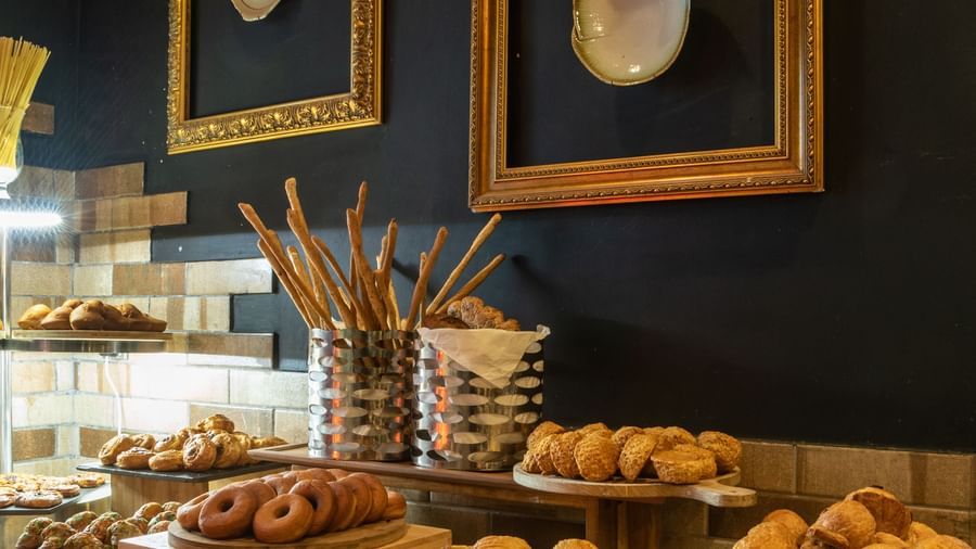 Counter display of bread, fruit, and pastries at Best Western Premier Westlands.