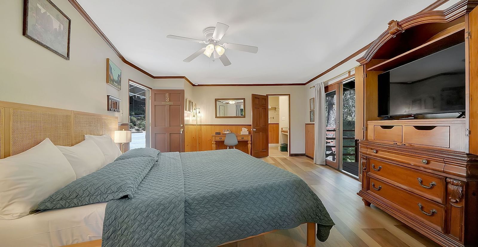 A room at Narrow Gauge Inn with a double bed and a television.