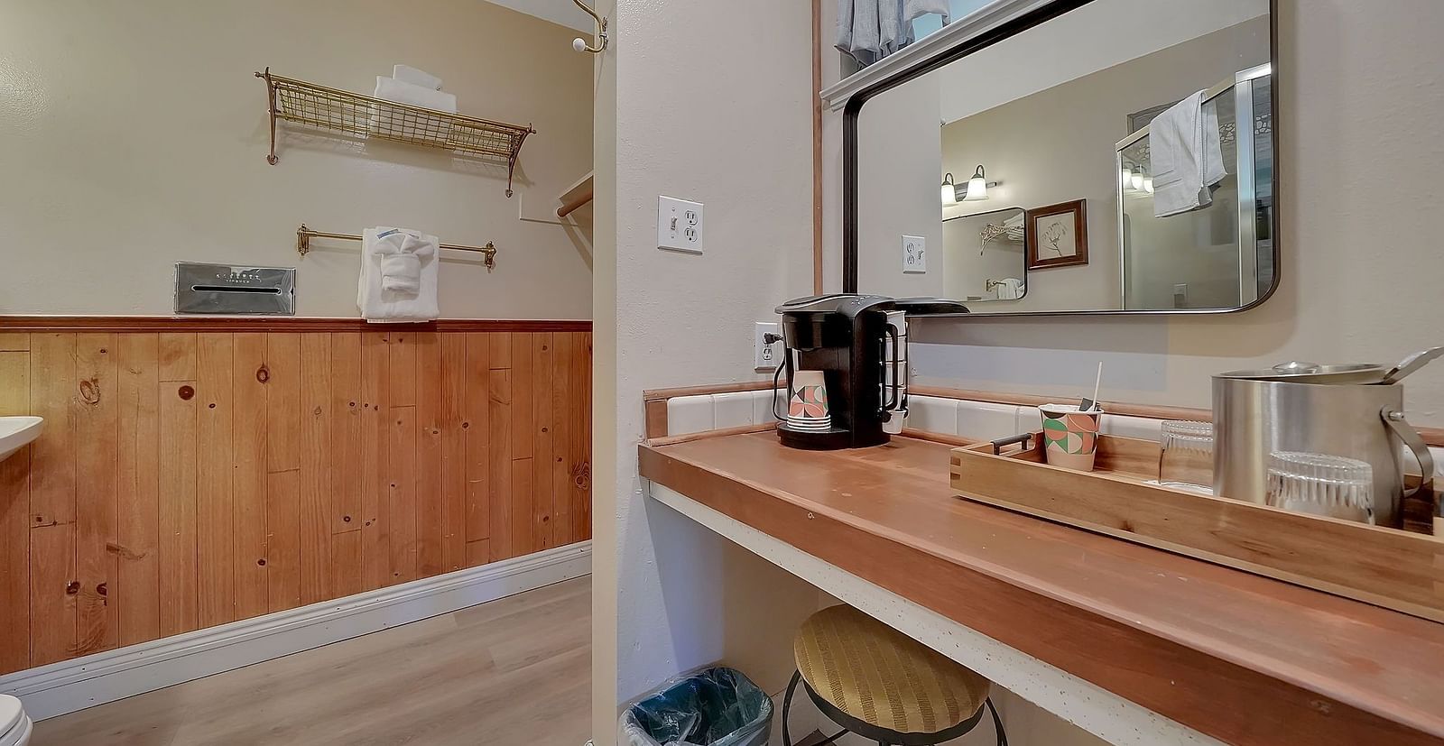A coffee machine placed on a table besides a wooden tray with a mug and creamer - Narrow Gauge Inn - A Serenite Hotel Near Fish Camp.