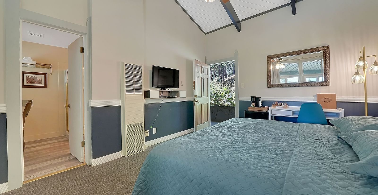 A view of a room at Narrow Gauge Inn with a double bed.