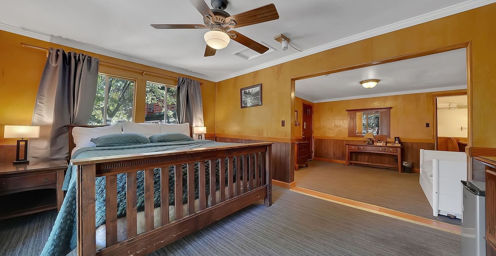 A view of a room at Narrow Gauge Inn with a double bed.