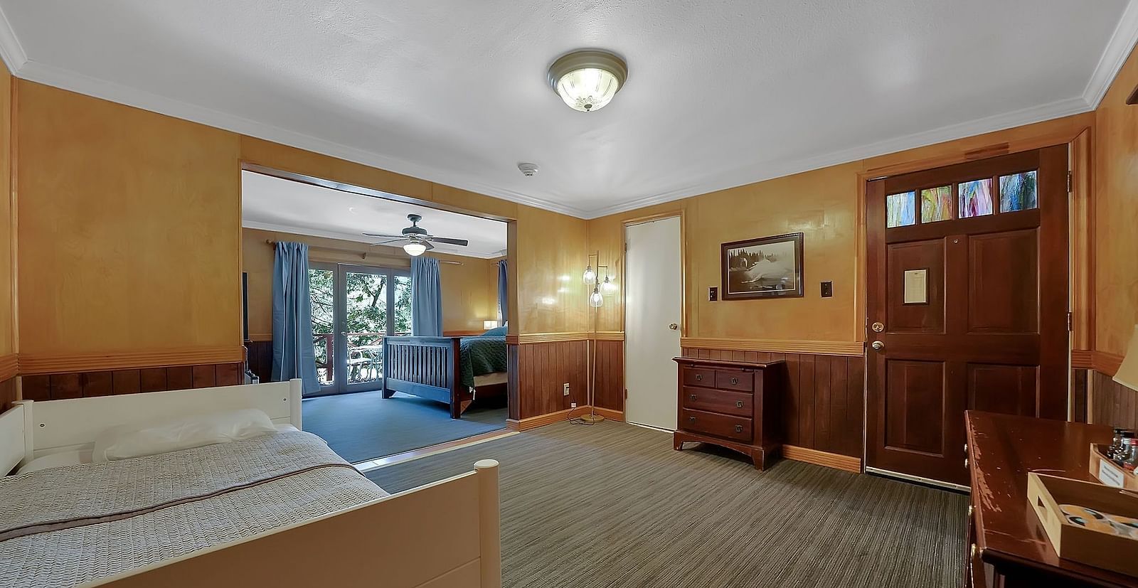 Living area of a room at Narrow Gauge Inn with a cabinet.