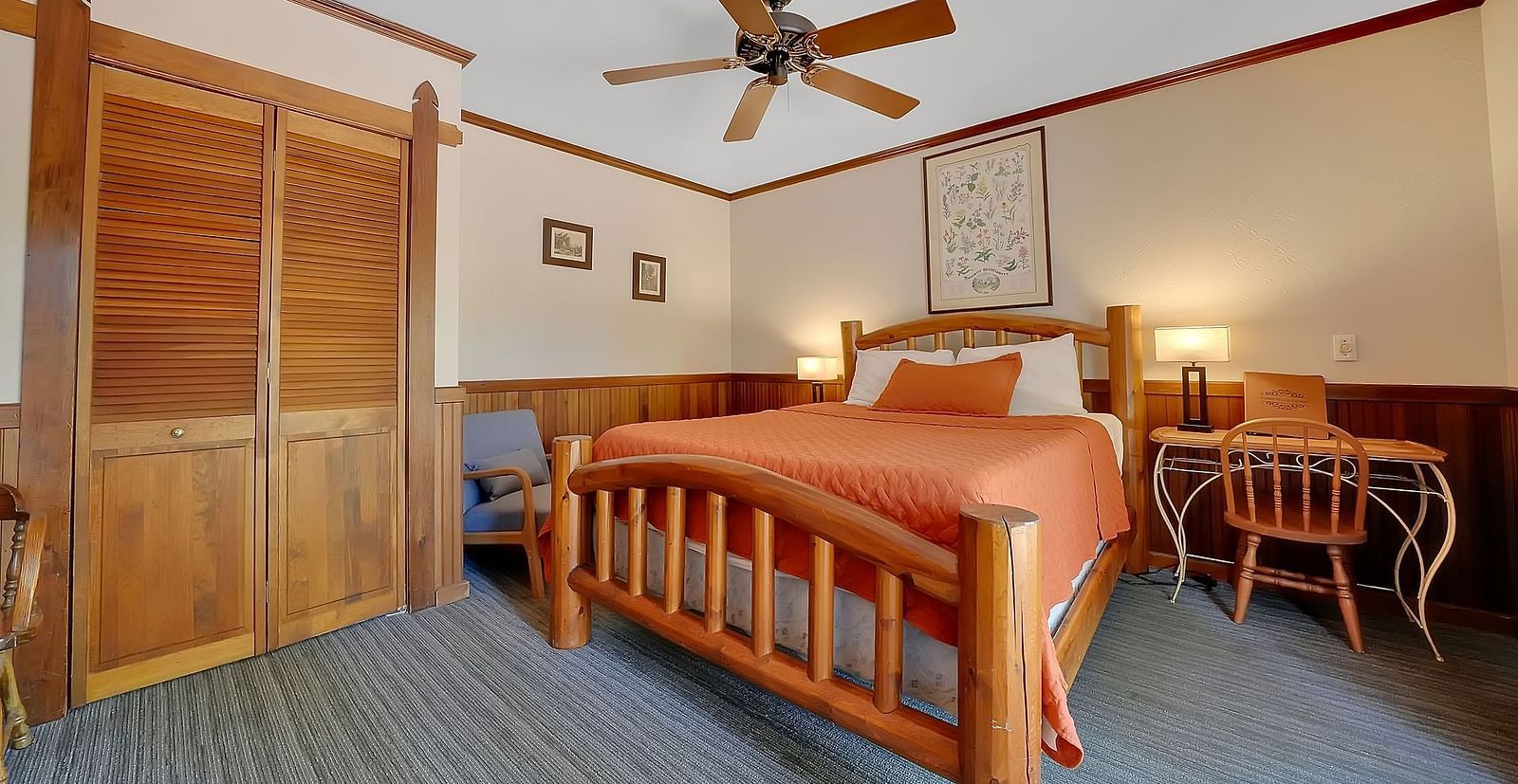 A view of a room at Narrow Gauge Inn with a double bed.