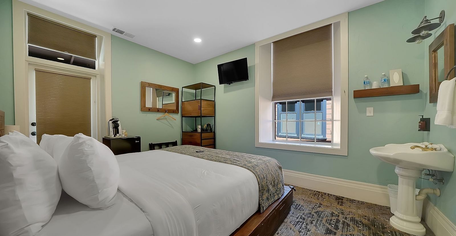 A view of a room at The Groveland Hotel with a double bed.