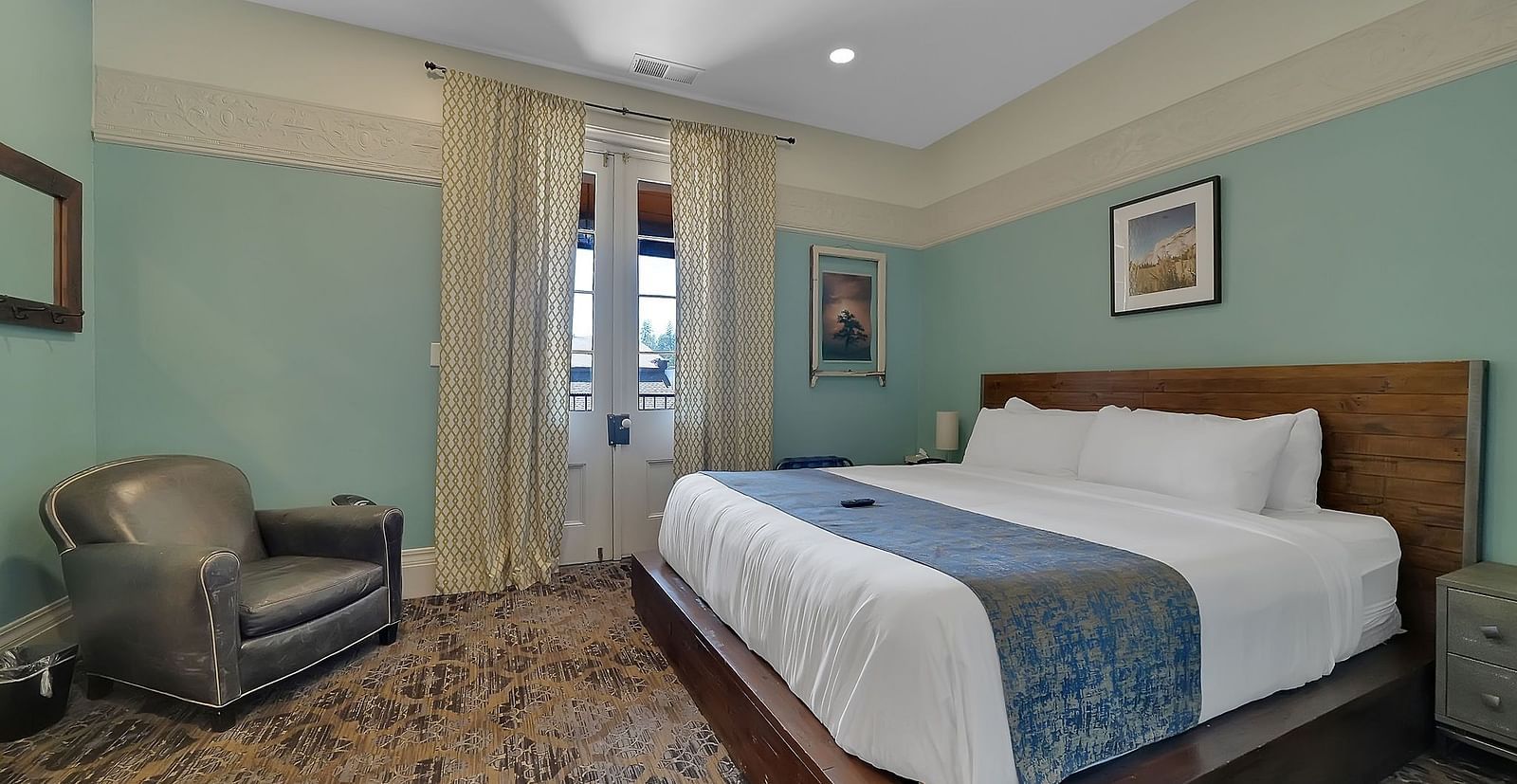 A view of a room at The Groveland Hotel with a double bed.