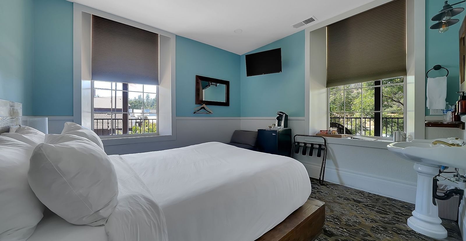 A view of a room at The Groveland Hotel with a double bed.