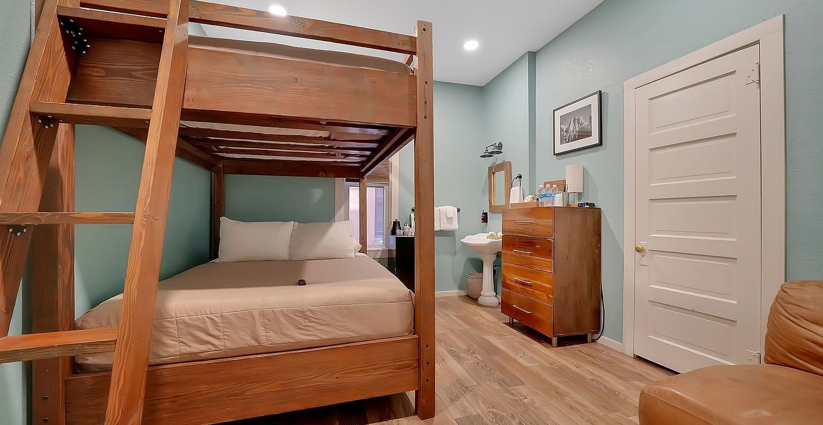A view of a room at The Groveland Hotel with bunk beds.