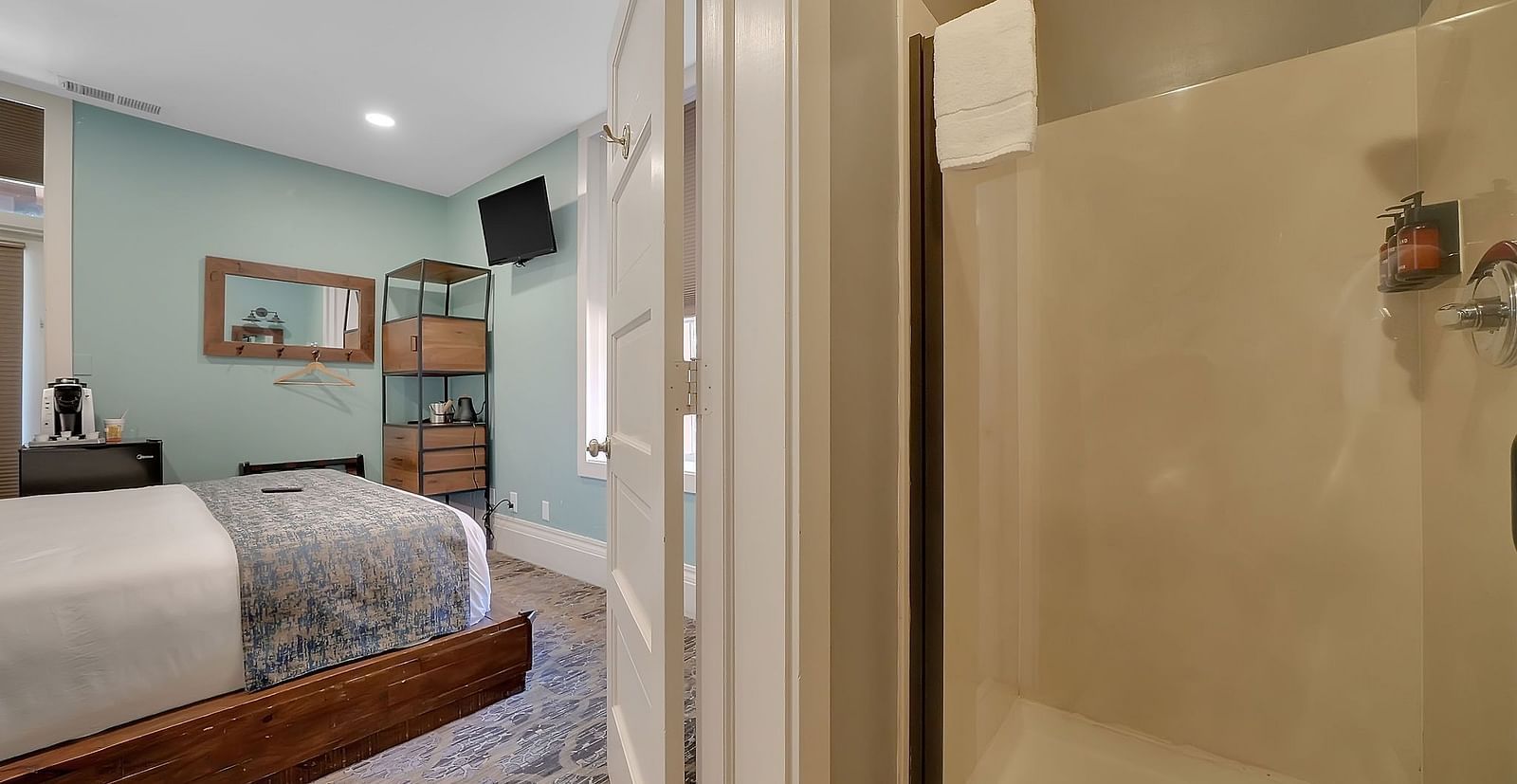 A view of a room at The Groveland Hotel with a double bed.