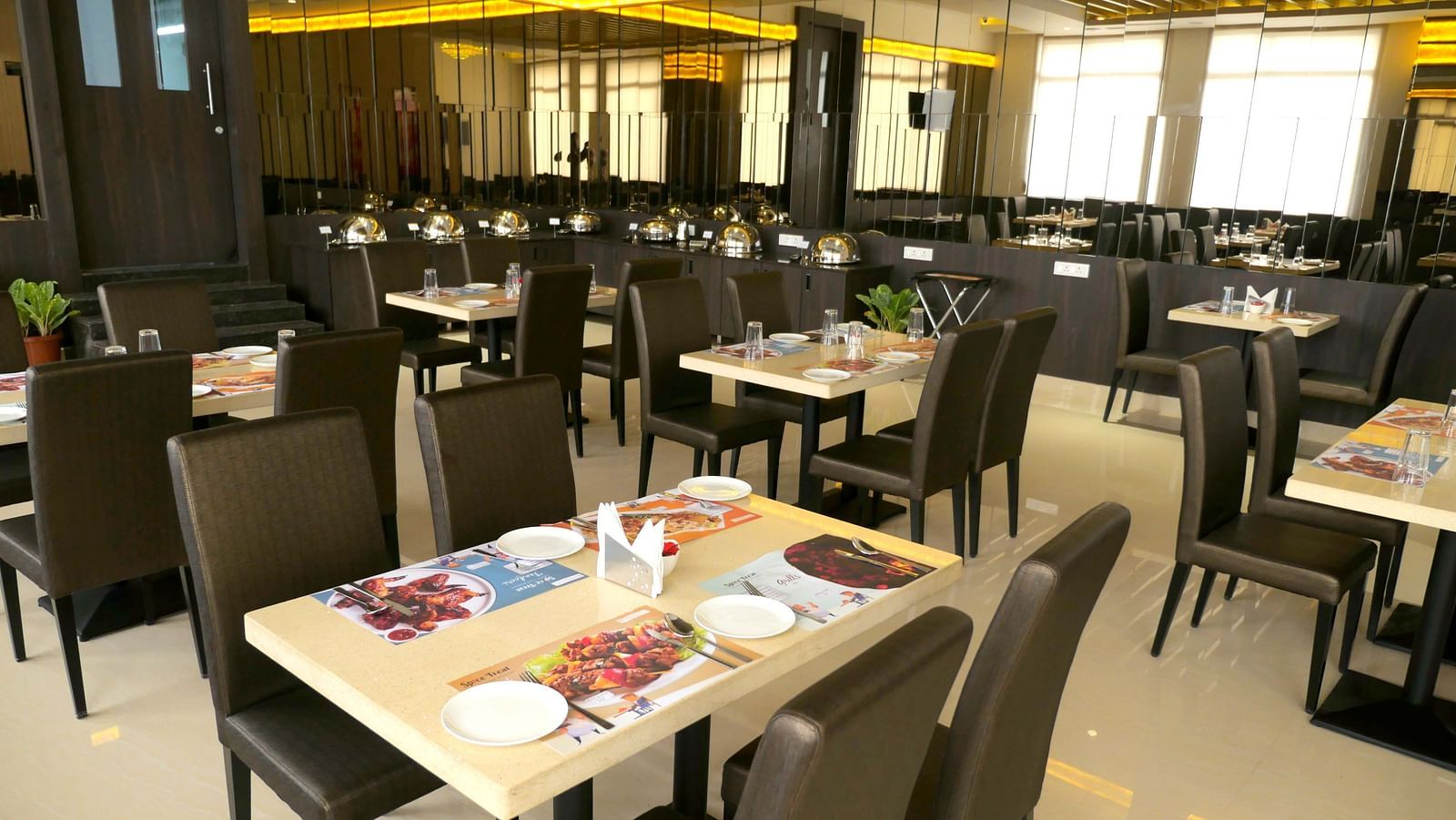 dining of a restaurant with warm lights of ASR Parklane, Hosur