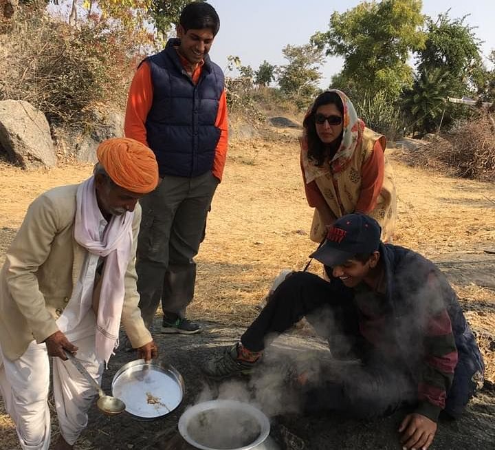 Locals preparing a meal in the field - Dev Shree, Deogarh