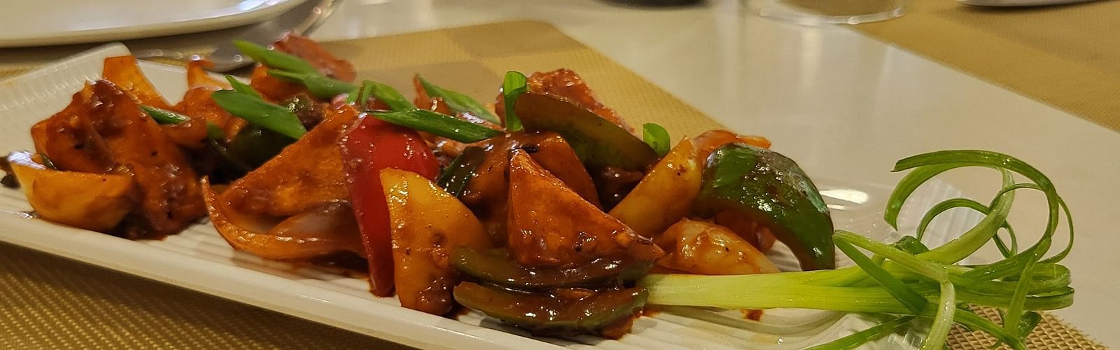 An image of a delicious savoury served in a platter at the restaurant of Inde Hotel Gold Course Extension, Gurgaon