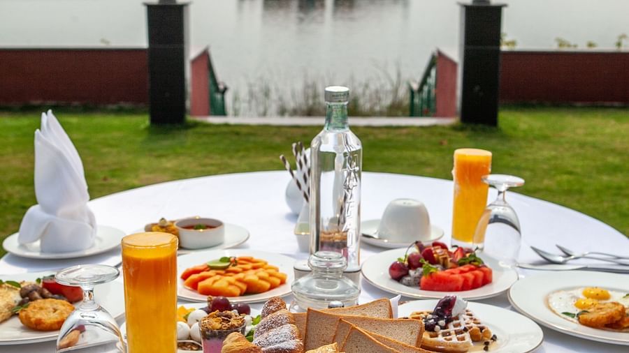a dining table filled with food -Mayfair Lake Resort, Raipur 6