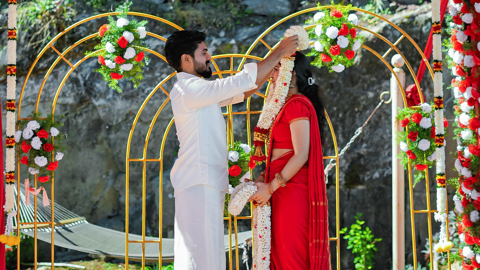  Outdoor wedding mandap at Grand Palace, Yercaud, floral hanging décor, couple holding hands, stages, floral mats, backdrop and soft lighting for ceremony