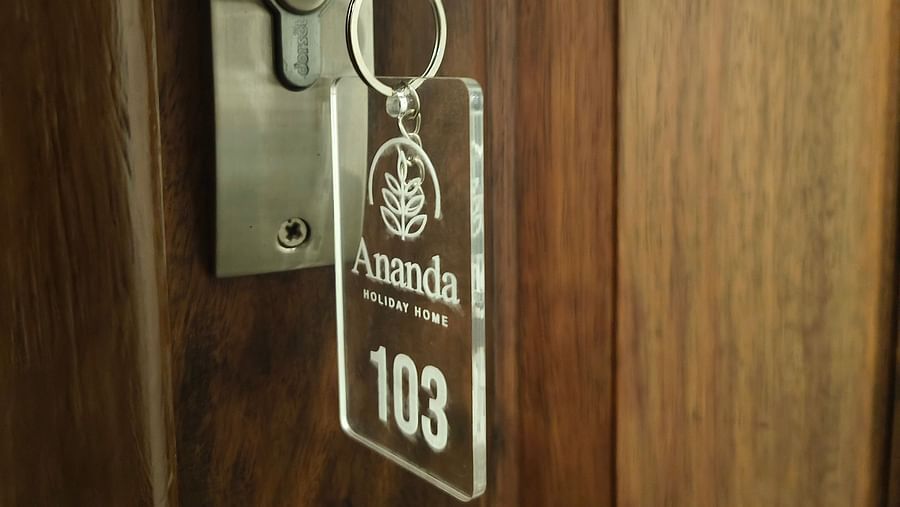 Key chain of room 103 hanging on its door at Ananda Holiday Home, Wayanad 2