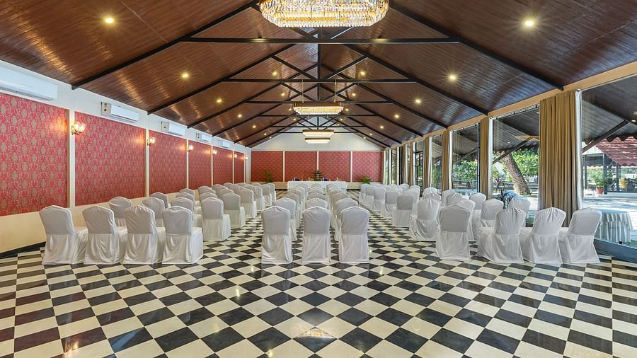 image of the banquet hall at aranya vilas with chairs set in a typical theatre setting 