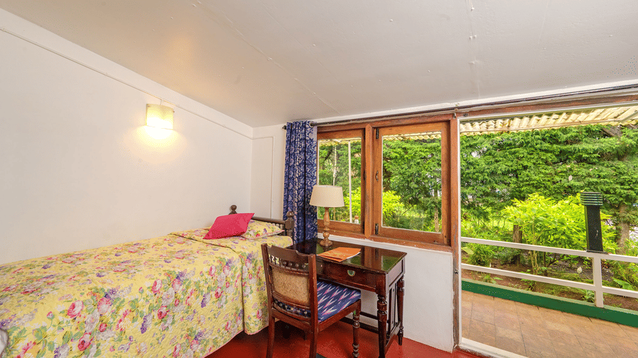 Cherry Blossom bedroom at Wallwood Garden - 19th Century, Coonoor with single bed, writing desk and direct access to the garden.
