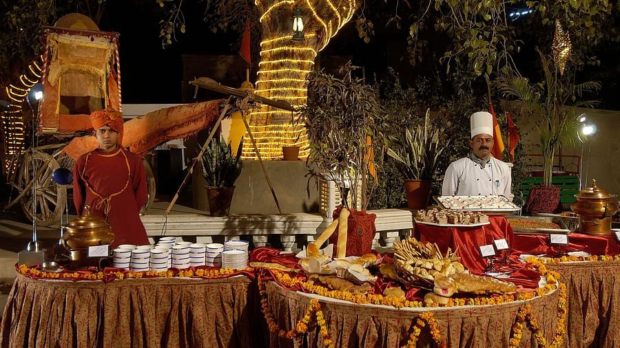 Gala Dinner at Gulab Bagh with people serving food  - Hotel Castle Mandawa, Jhunjunu