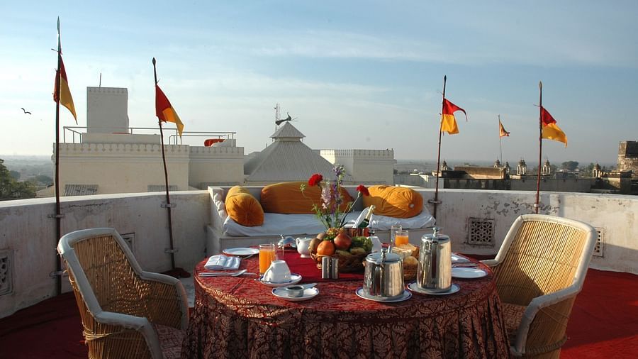 a dining setup during daytime with food on the table  - Hotel Castle Mandawar, Jhunjunu