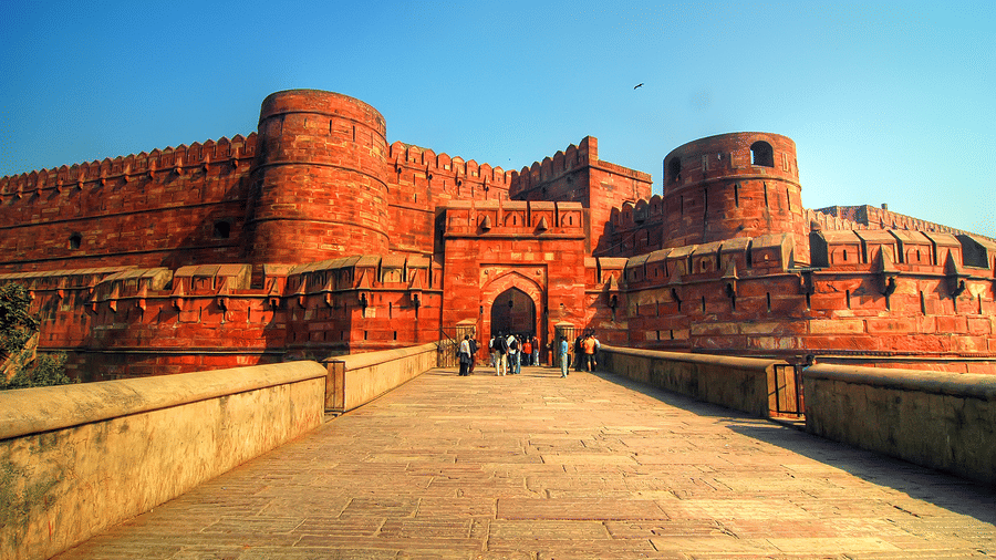 Red Fort in Agra featuring a huge structure and a long pathway