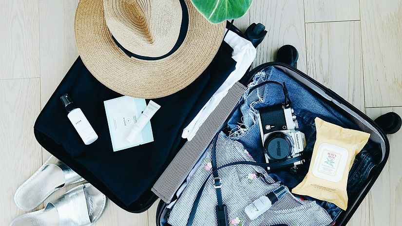 A suitcase with all travel essentials 