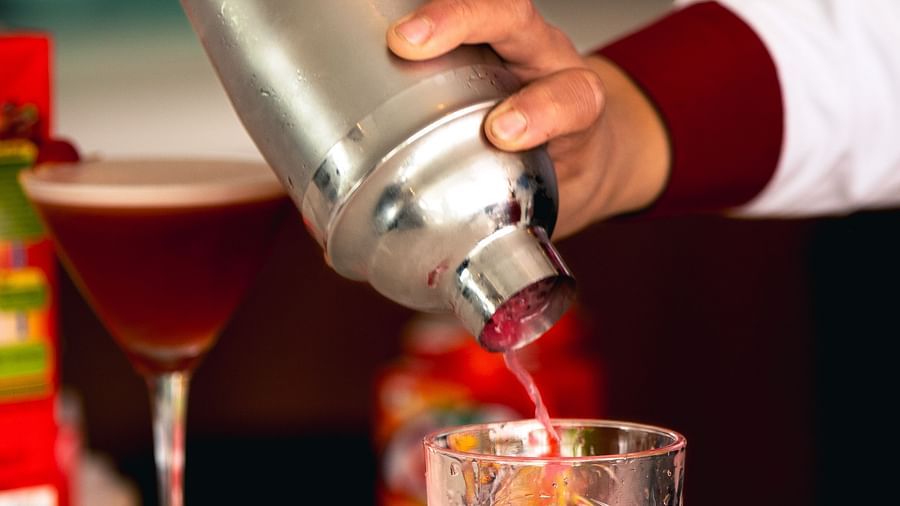Close up shot of a drink being poured into a glass on a counter at Mandala Norling Lords Prime in Kathmandu.