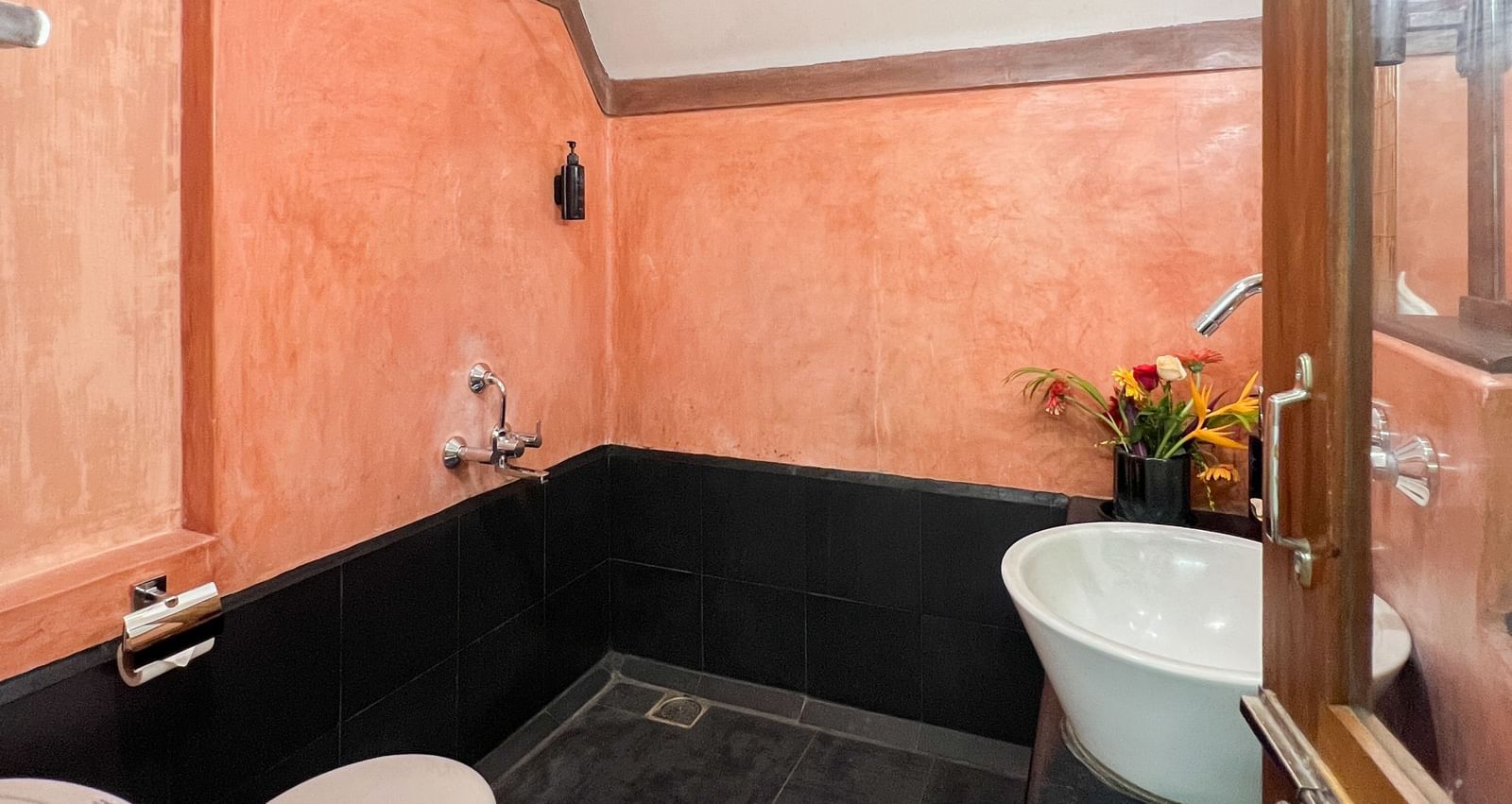 Thai Cottage Washroom with a toilet and mirror.