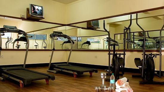 Ramanashree California Resort - view of the gymnasium containing treadmill and dumbbells