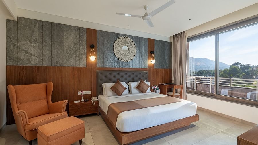 view of a king size bed of Superior Room at Stone Wood Hotel, Kumbhalgarh
