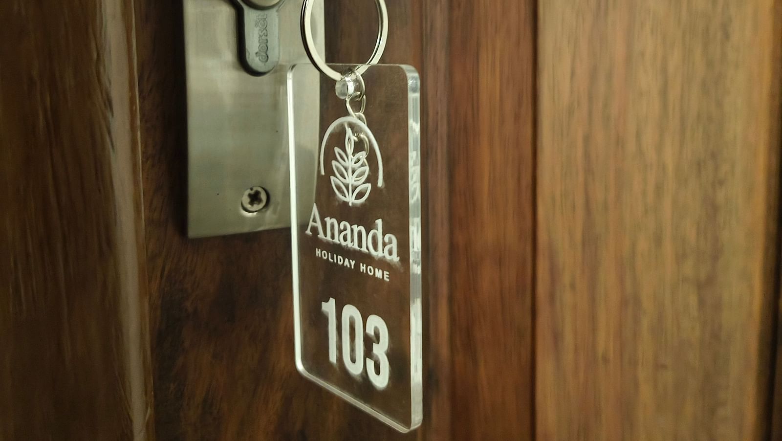 Key chain of room 103 hanging on its door at Ananda Holiday Home, Wayanad 2