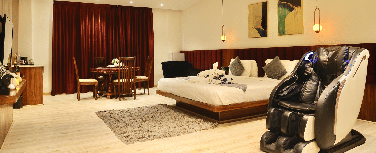 Club Suite, Massage chair and dining setting in the suite