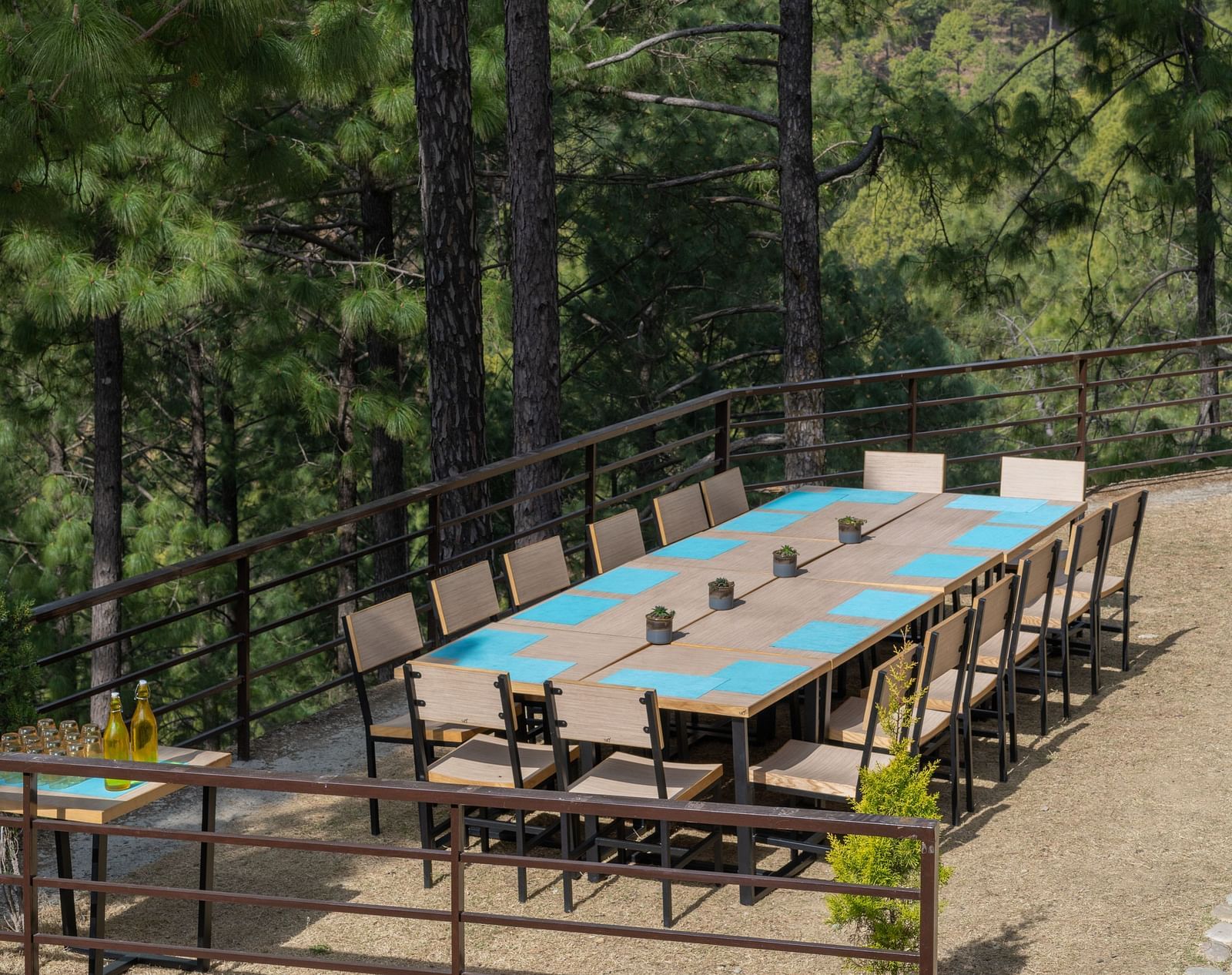 Lawn with neatly arranged chairs and a long table set up for an event at BluSalzz Escapade Resort, Lansdowne
