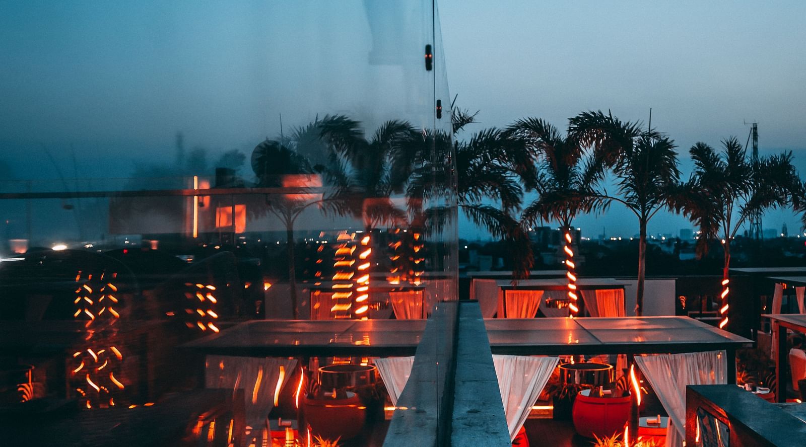 a view of a restaurant near Marina Beach with the infinity pool in front and city views visible on the edge - Hotel Park Elanza, Chennai
