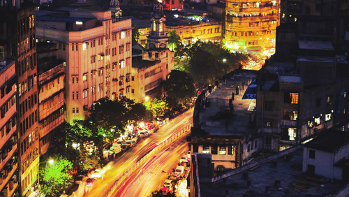 An aerial view of Park Street in Kolkata with a long exposure of vehicles moving on the road as seen during twilight hour.