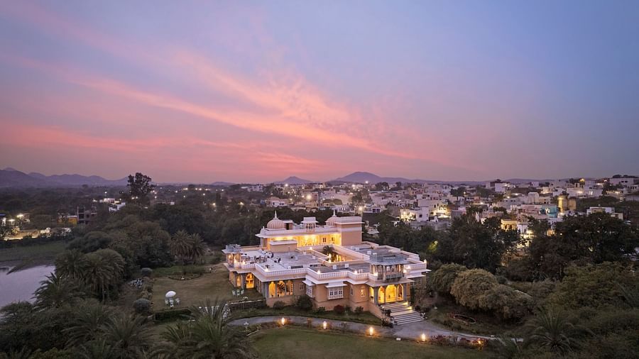 Facade image of Dev Shree, deogarh featuring a beutiful sunset in the background