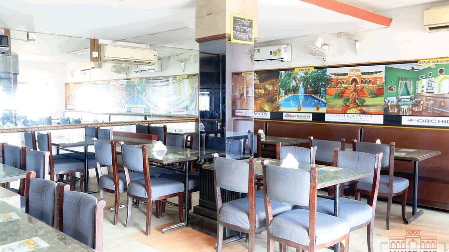 Indoor view of Vithal Kamat family restaurant with dining tables and chairs arranged for guests