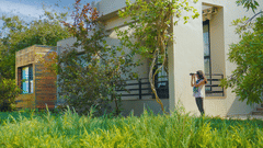 Women clicking a picture outside a room - Excursions- The Golden tusk