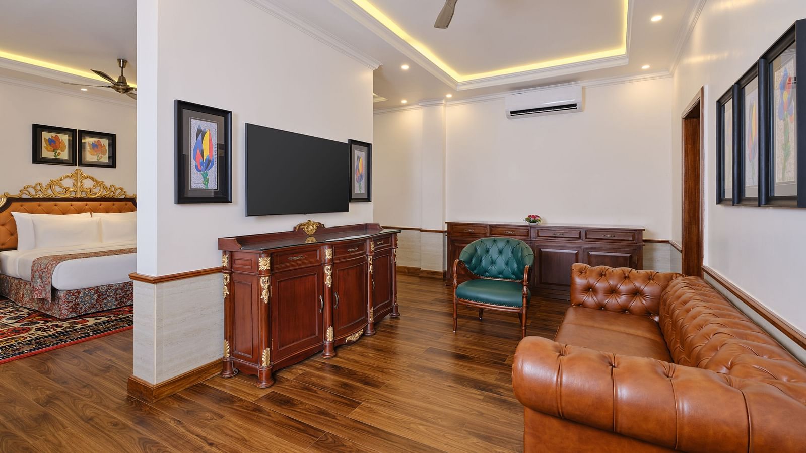 A room at Regent villa with sofa, cupboard, TV and tiled floor at Mayfair spa resort and casino.