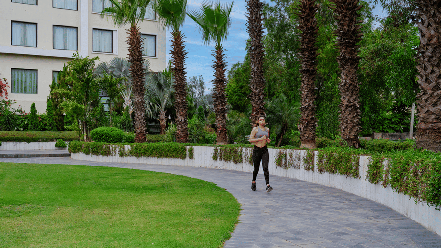 Shot of  a woman out for a jog inside the hotel.