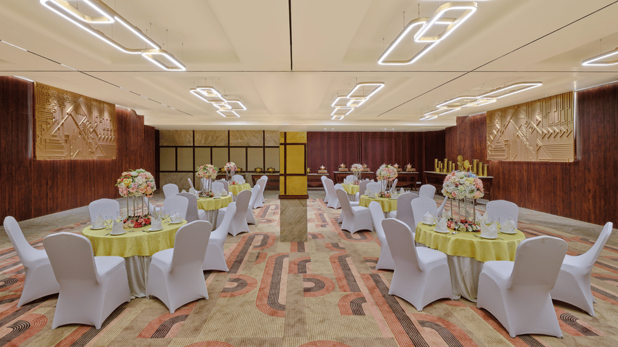 Image of a large banquet hall with tables and chairs | Best Western Country Woods Hotels and Resorts