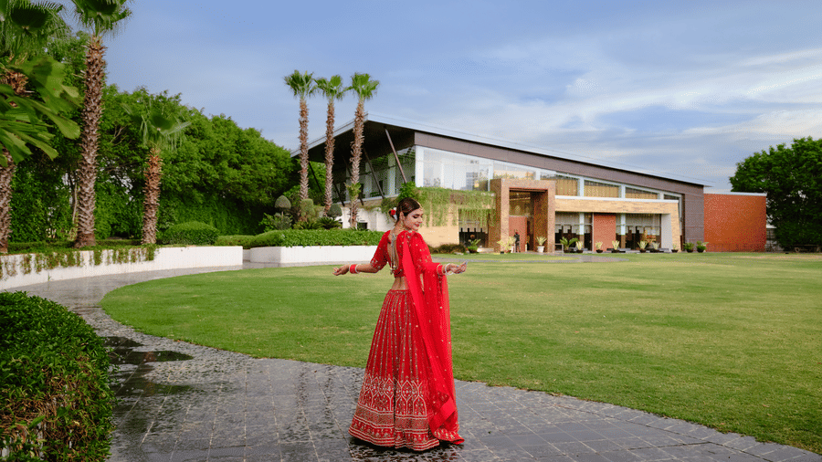 Image of a women getting her bridal shoot done in the lawn of the hotel | Best Western Country Woods Hotels and Resorts