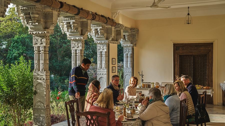 an image of people having food in the dining space at dev shree, deogarh