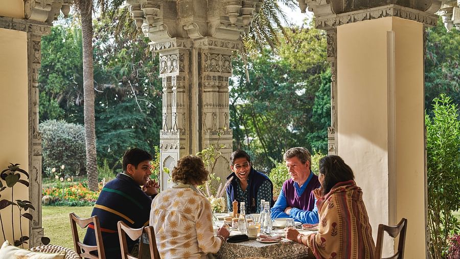 image of a group of guests feasting at an open dining space at dev shree deogarh