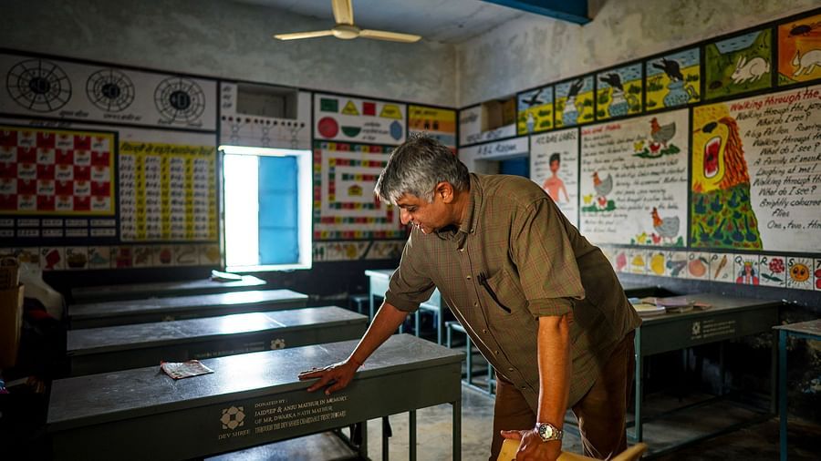 image of an old man cleaning the classroom with a window allowing natural light into the room