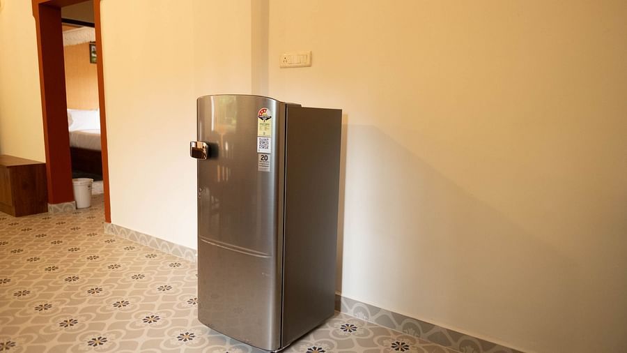 Image of a fridge placed against a wall at the  2 bhk Studio Apartment, Vistar Holidays, Goa.