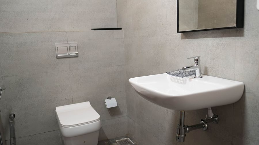 Image of a sink and toilet at the 1 bhk Executive Studio Apartment, Vistar Holidays, Goa.