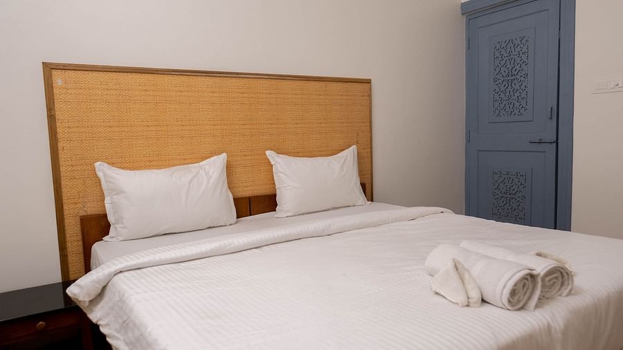 Image of a bed with towels placed on it at 1 bhk Deluxe Studio Apartment, Vistar Holidays, Goa.