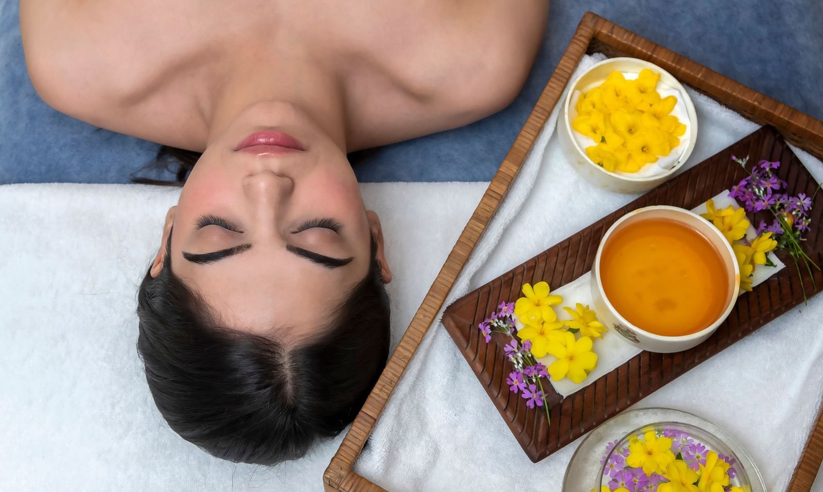 image of a woman going for a relaxing spa treatment at The Claridges Nabha Residence